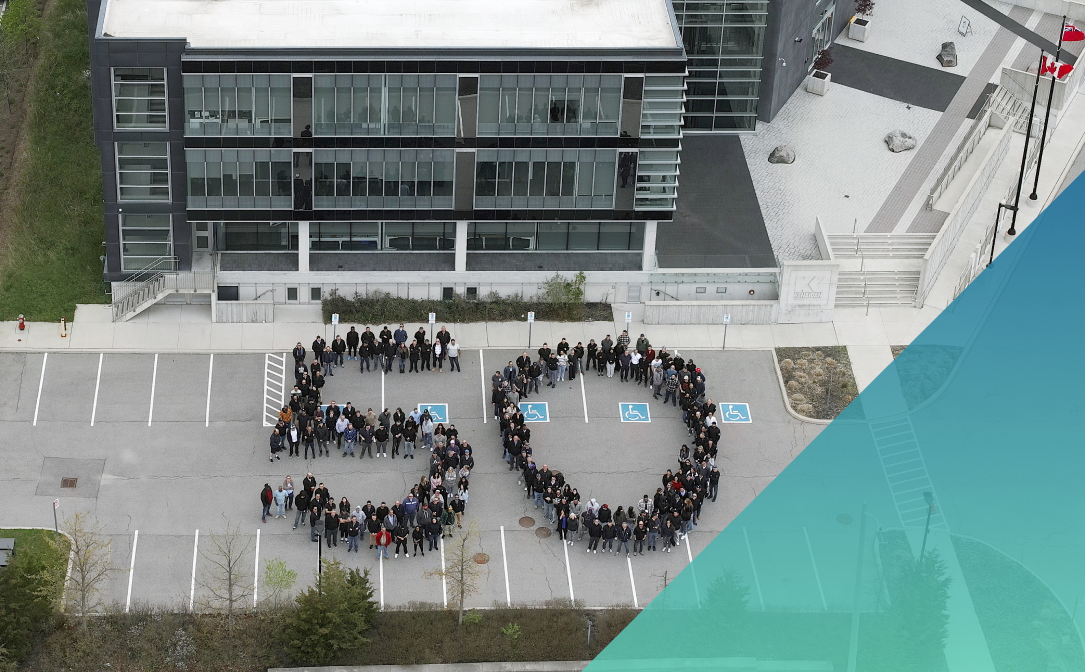 Aerial view of Kenaidan office with employees lined up to make the number 50