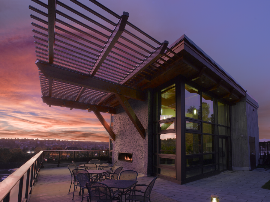 building with outdoor patio and fireplace