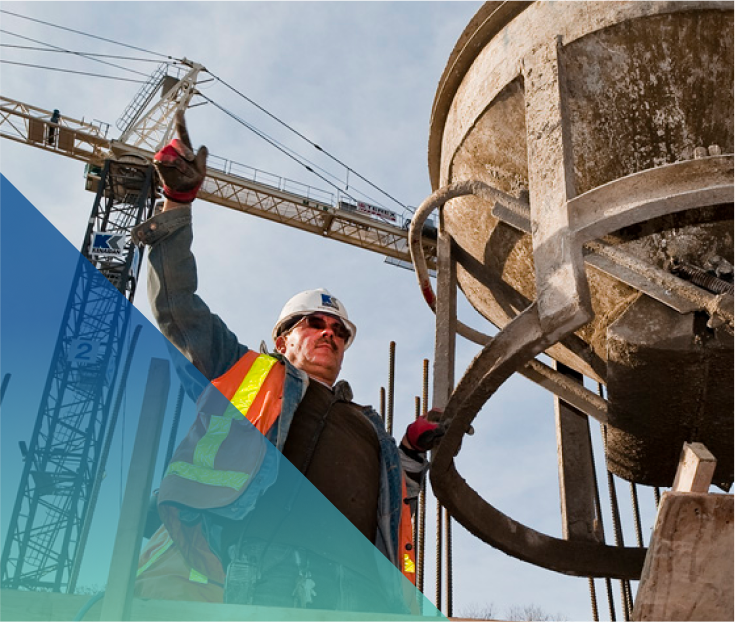 a construction worker guiding a cement hopper