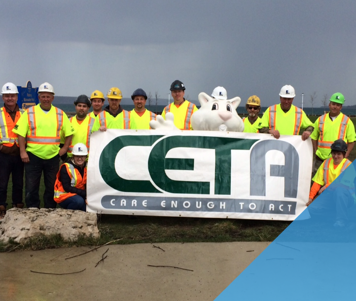 a group photo at a CETA construction site